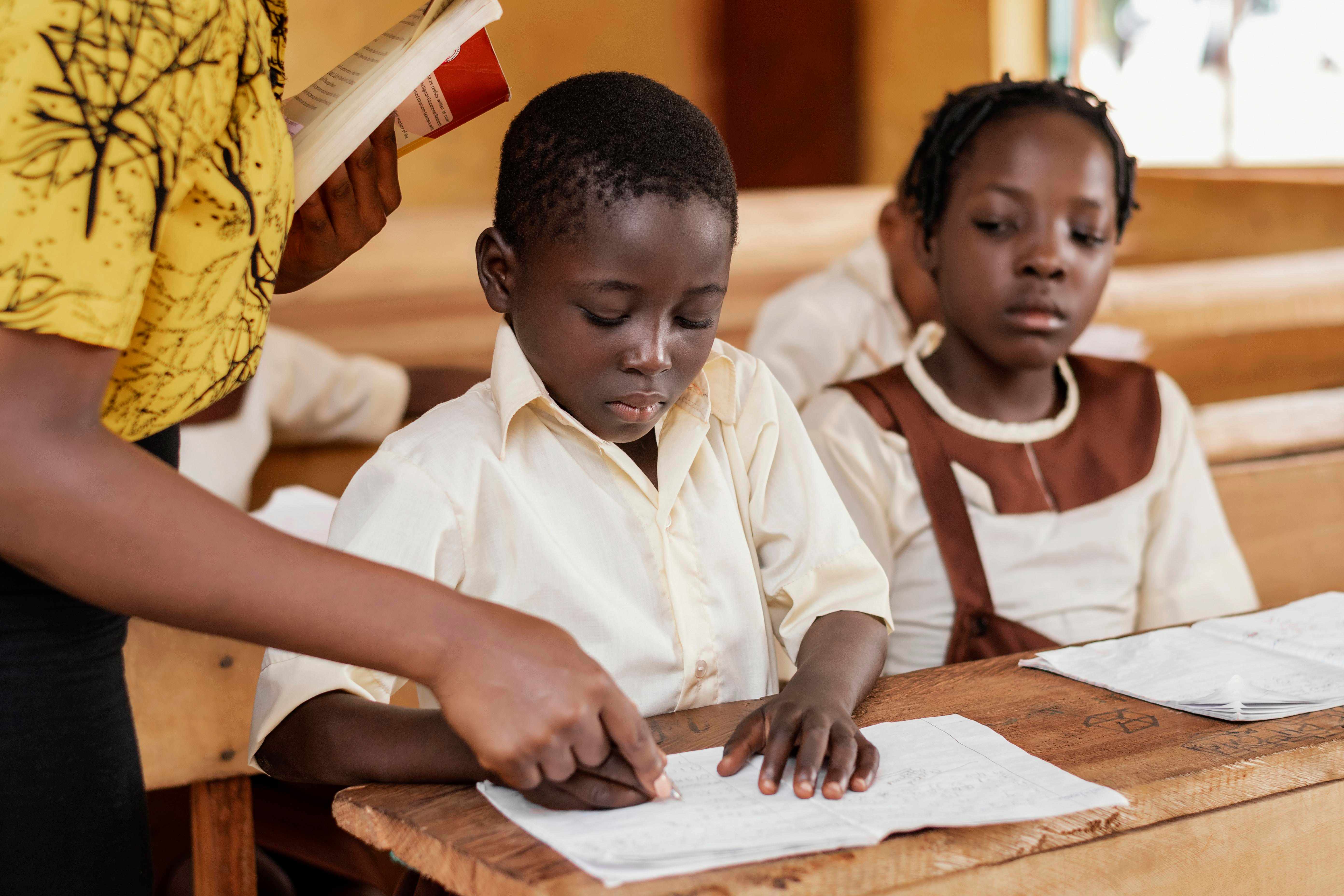 Children learning in a classroom for education support